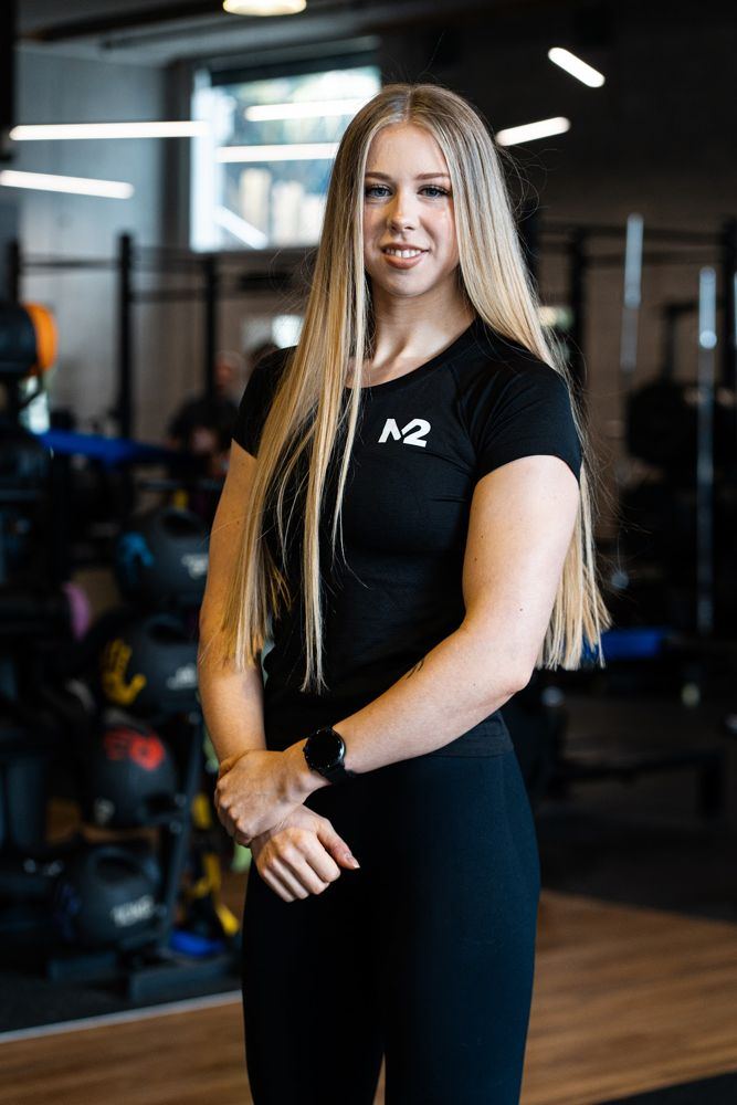 Coach Madeliene, powerlifting and transformation coach at M2